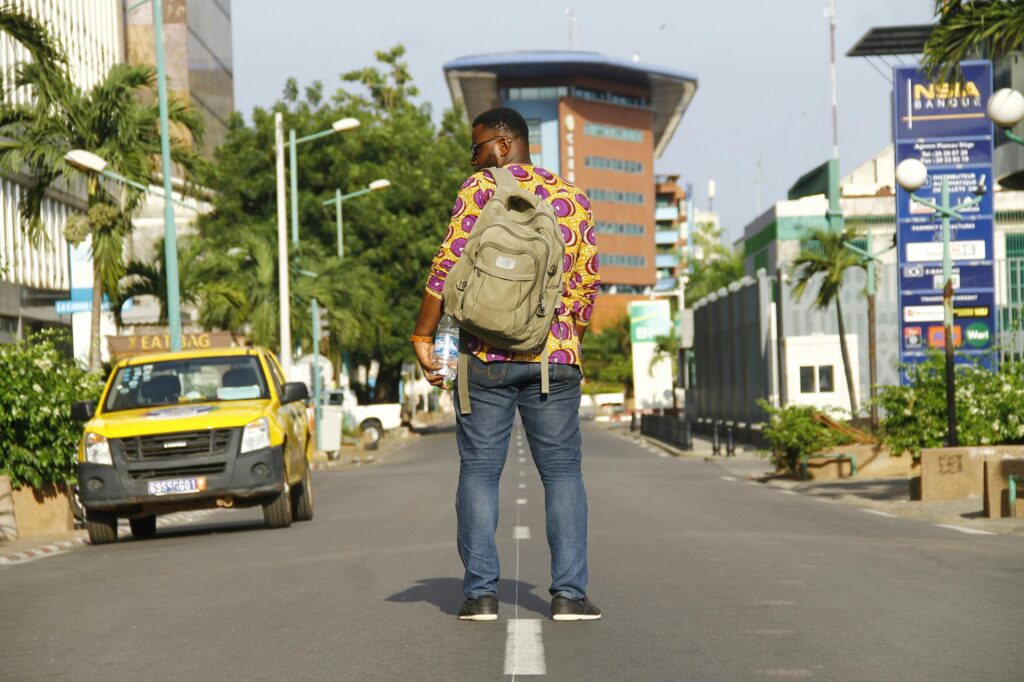 Man Standing in Middle of the Road